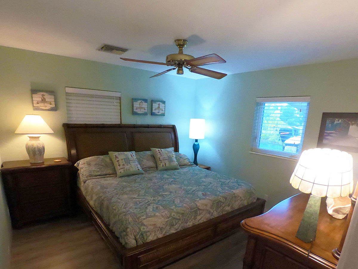 Main House Waterfront King Bedroom is located off the Great Room and overlooks the canal